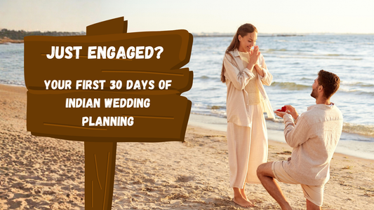 Indian couple just engaged on a beach - first 30 days of wedding planning